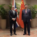 Prime Minister Keir Starmer and President Xi Jinping meeting during the G20 summit, symbolizing the reset of UK-China diplomatic relations.